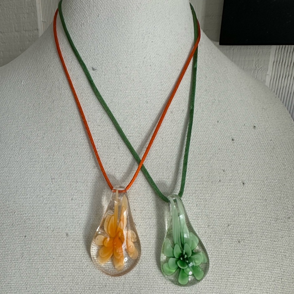 Two tear drop glass flower necklaces on satin cord